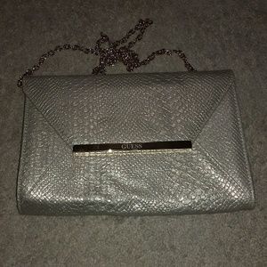 Guess Gold Clutch and has an chain